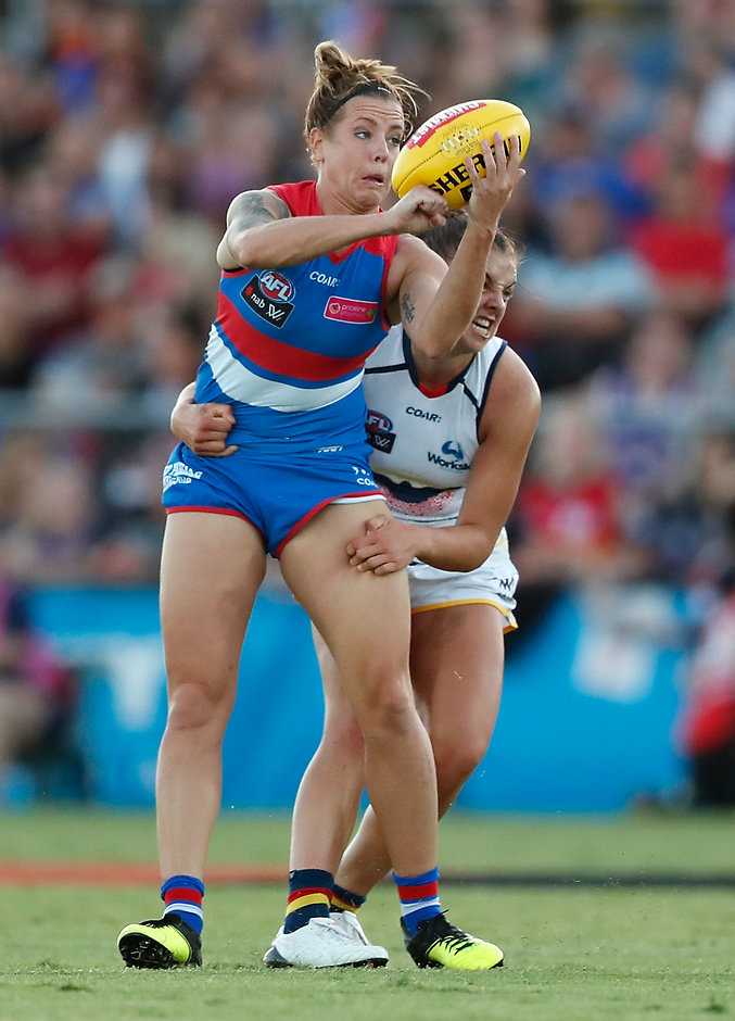 AFLW 2017 Rd 02 - Western Bulldogs v Adelaide MELBOURNE, AUSTRALIA - FEBRUARY 10: Hannah Scott of the Bulldogs is tackled by Ebony Marinoff of the Crows during the 2017 AFLW Round 02 match between the Western Bulldogs and the Adelaide Crows at VU Whitten Oval on February 10, 2017 in Melbourne, Australia. (Photo by Adam Trafford/AFL Media)